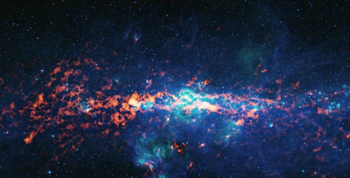 The ATLASGAL survey captured this color-composite image of the Galactic Centre and Sagittarius B2. The image shows ATLASGAL submillimetre-wavelength data in red, overlaid on an infrared view of the region from the Midcourse Space Experiment (MSX) in green and blue. You can see Sagittarius B2 as the bright orange-red region to the middle left of the image, centered on the Galactic Centre.